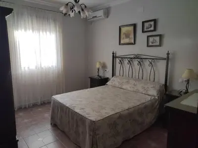 Cama o camas de una habitación en Casa Rural Alameda en Posadas Córdoba
