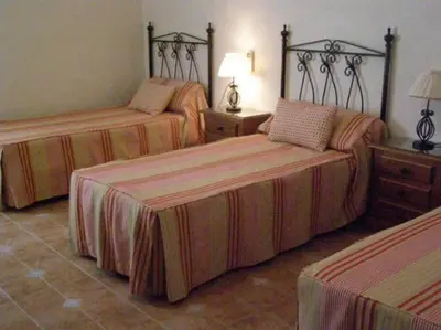 Cama o camas de una habitación en Casa Rural Alameda en Posadas Córdoba