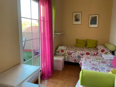 Cama o camas de una habitación en Familia Anfitriona acoge terraza