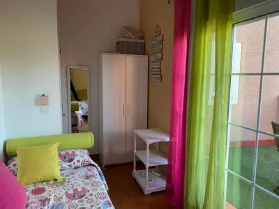 Cama o camas de una habitación en Familia Anfitriona acoge terraza
