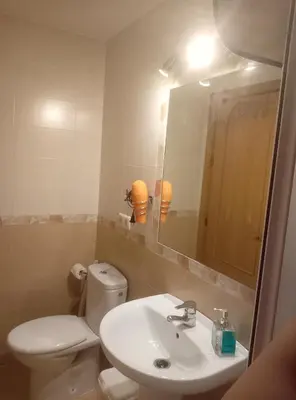 Un baño de Apartamento La Reina Home