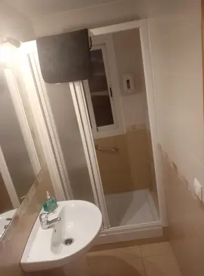 Un baño de Apartamento La Reina Home