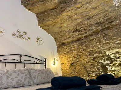 Cama o camas de una habitación en Casa Cueva Sol y Luna Setenil