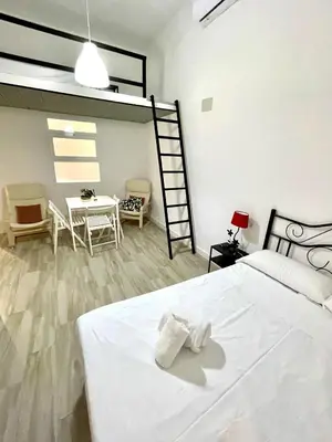 Cama o camas de una habitación en Alojamientos La Noria de la Albolafia