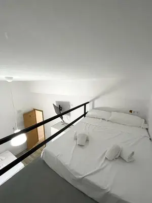 Cama o camas de una habitación en Alojamientos La Noria de la Albolafia