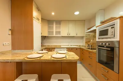 Una cocina o zona de cocina en Charming 2 Bedroom Apartment at Sevilla City Center By OCityzen