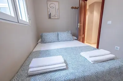 Cama o camas de una habitación en Apartamento céntrico Rincón de Ensueño Parking gratis