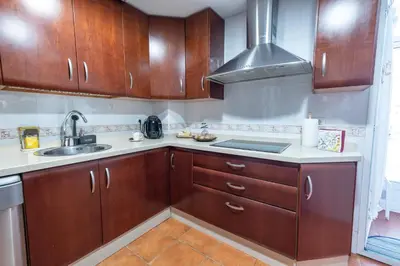 Una cocina o zona de cocina en Apartamento céntrico Rincón de Ensueño Parking gratis