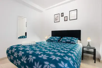 Cama o camas de una habitación en San Pagés 3BR Apartment