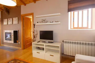 Una televisión o centro de entretenimiento en Apartamento Jaen Catedral, Centro historico, espacioso, plaza parking