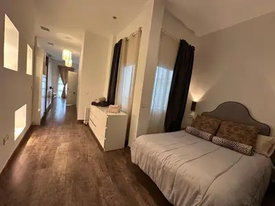 Cama o camas de una habitación en Plaza de los Curtidores sevilla
