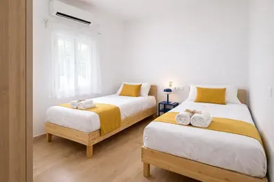 Cama o camas de una habitación en Apartamento Turístico Ciudad Jardín - Nervión.
