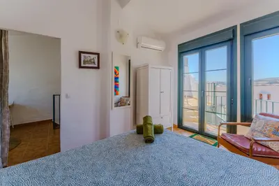 Cama o camas de una habitación en Casa del Patito with Vista by Duckling Stays