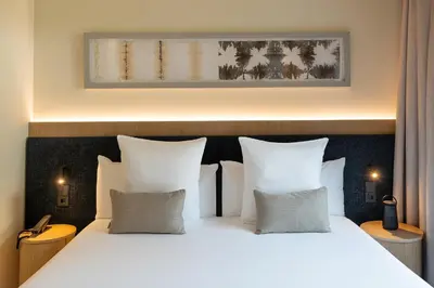 Cama o camas de una habitación en Ocean Drive Sevilla