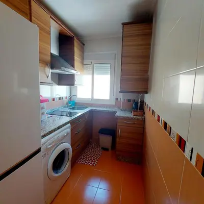 Una cocina o zona de cocina en EN CÁ TITO. Luminoso y céntrico. Sevilla auténtica