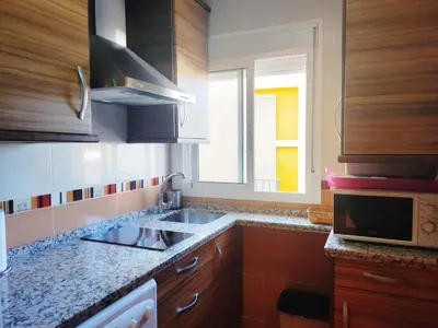 Una cocina o zona de cocina en EN CÁ TITO. Luminoso y céntrico. Sevilla auténtica