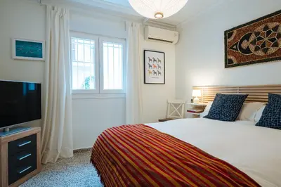 Cama o camas de una habitación en Muro de los Navarros Suite Apartment