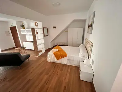 Cama o camas de una habitación en Apartamentos EL PELIGRO 5 ZAGUAN