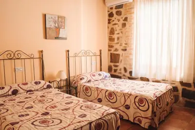 Cama o camas de una habitación en Casa Rural El Capricho de Flor
