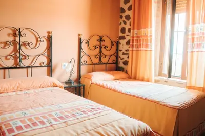 Cama o camas de una habitación en Casa Rural El Capricho de Flor