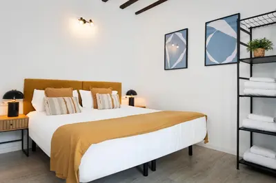 Cama o camas de una habitación en Correduría Suites Apartments