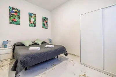 Cama o camas de una habitación en Living Cordoba Apartamentos