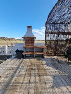 Un balcón o terraza de VILLA BILBILIS con piscina privada, barbacoa y parking