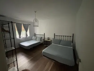 Cama o camas de una habitación en CASERIO LA SEVILLANA
