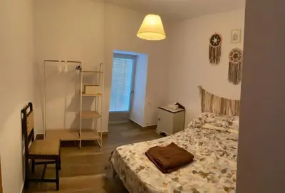 Cama o camas de una habitación en CASERIO LA SEVILLANA