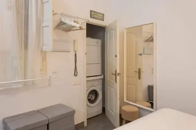 Cama o camas de una habitación en WISH SUITE SANTA CLARA DE SEVILLA