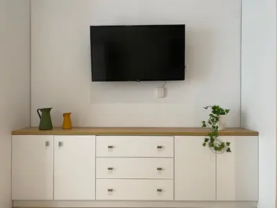 Una televisión o centro de entretenimiento en Apartamento Andalucía Centro II
