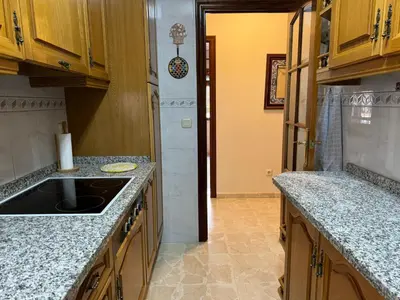 Una cocina o zona de cocina en Apartamento Buen Pastor con parking gratuito