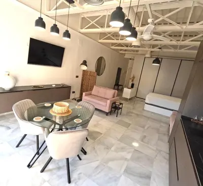 Una televisión o centro de entretenimiento en Loft Puerta de Capitulares