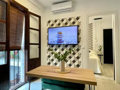 Una televisión o centro de entretenimiento en Geysotur Suite de Anabel