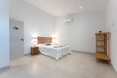Cama o camas de una habitación en MalagaSuite Villa Nomada El Torcal