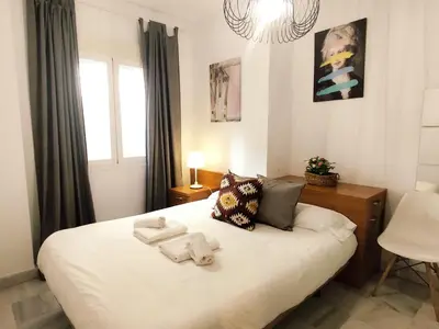 Cama o camas de una habitación en APARTAMENTO SAN LUIS. Plaza de Parking Gratis!!!