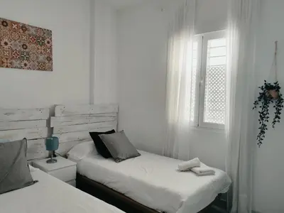 Cama o camas de una habitación en APARTAMENTO SAN LUIS. Plaza de Parking Gratis!!!