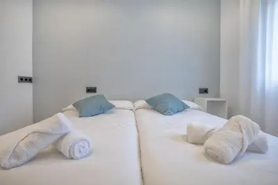 Cama o camas de una habitación en Apartamento DOMI & Parking Incluido