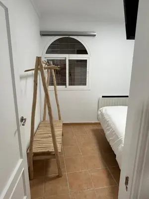 Cama o camas de una habitación en APARTAMENTOS JUAN RAMÓN JIMÉNEZ 3
