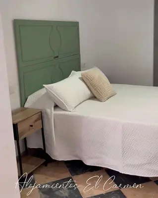 Cama o camas de una habitación en Alojamientos El Carmen