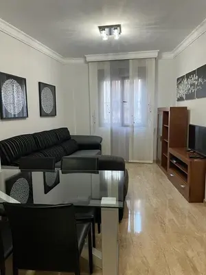 Una televisión o centro de entretenimiento en Apartamento La Muralla II