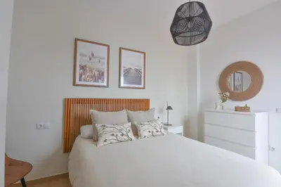 Cama o camas de una habitación en AROMA APARTAMENTO OLVERA