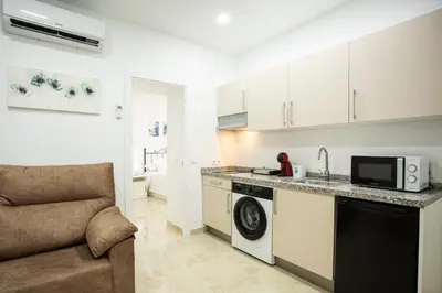 Una cocina o zona de cocina en WISH SUITE AMPARO DE SEVILLA