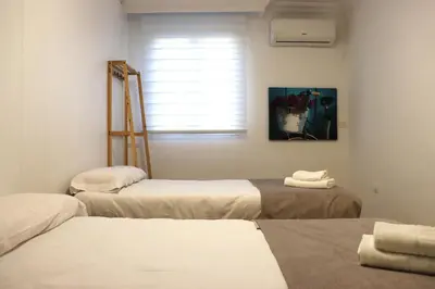 Cama o camas de una habitación en NightInSevilla Juglar Free parking