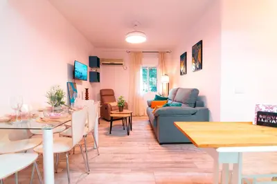 Una televisión o centro de entretenimiento en EDomus Playa y Sol Boutique