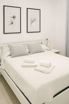 Cama o camas de una habitación en Alojamiento Baeza California 2B