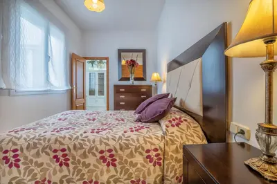 Cama o camas de una habitación en Kurtuba Suites