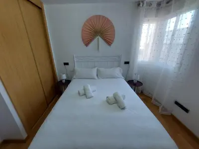 Cama o camas de una habitación en Apartamento CentroLinares Con Parking