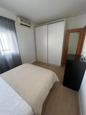 Cama o camas de una habitación en Apartamentos Rincón del Roldán - La Rinconada