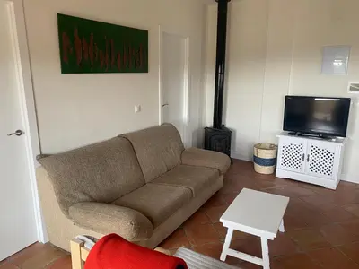 Una televisión o centro de entretenimiento en Villa Arriba